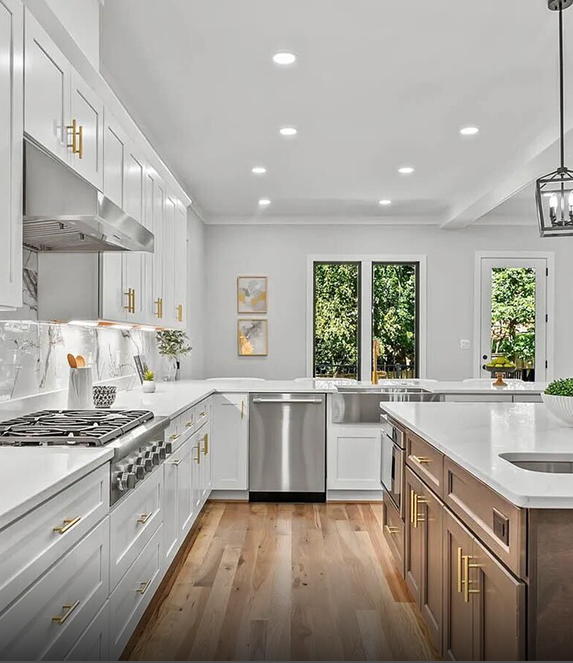 Modern kitchen with white cabinets and stainless steel appliances
